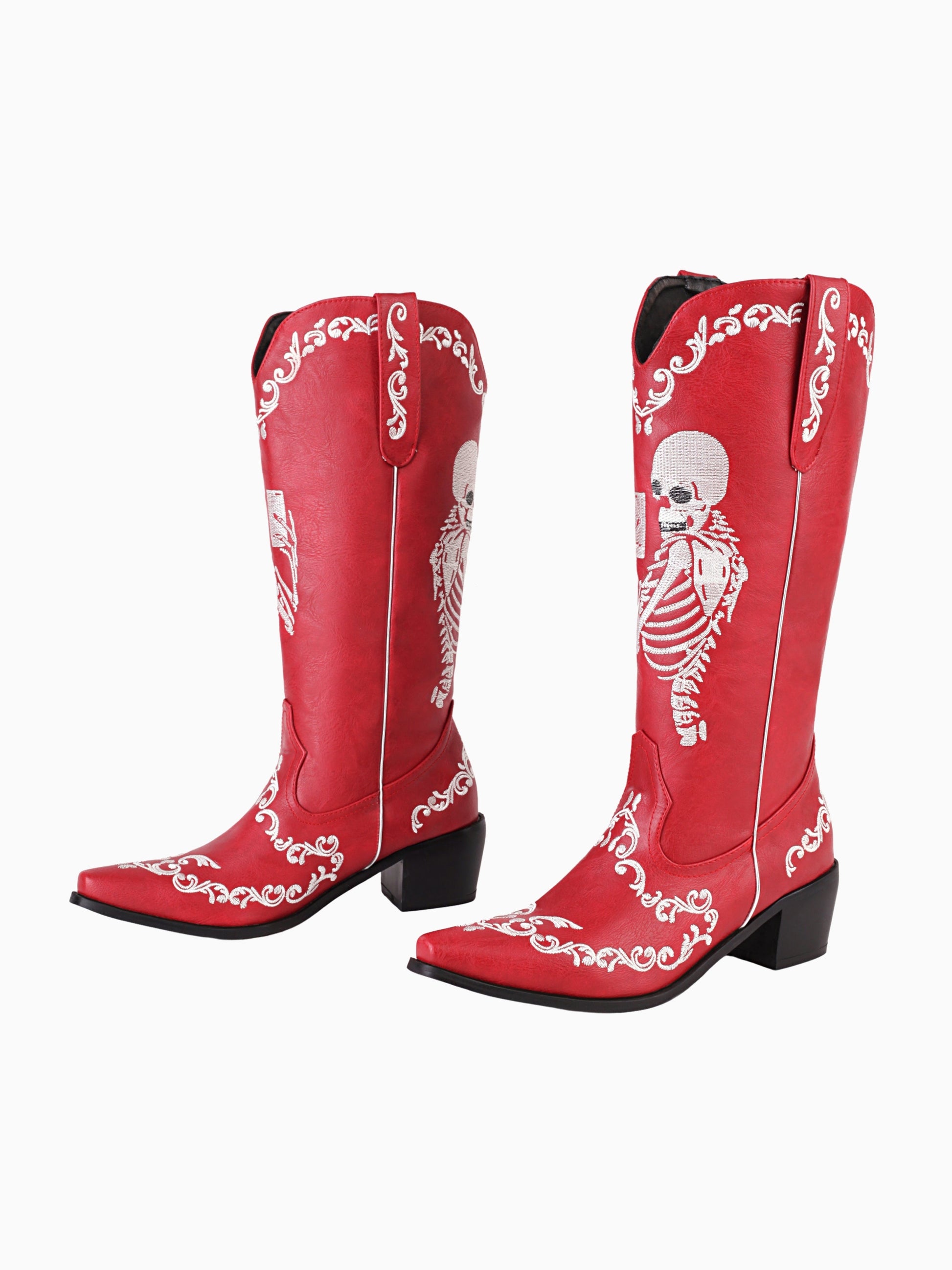 red mid calf cowgirl boots with white skeleton embroidery and ornate scroll details